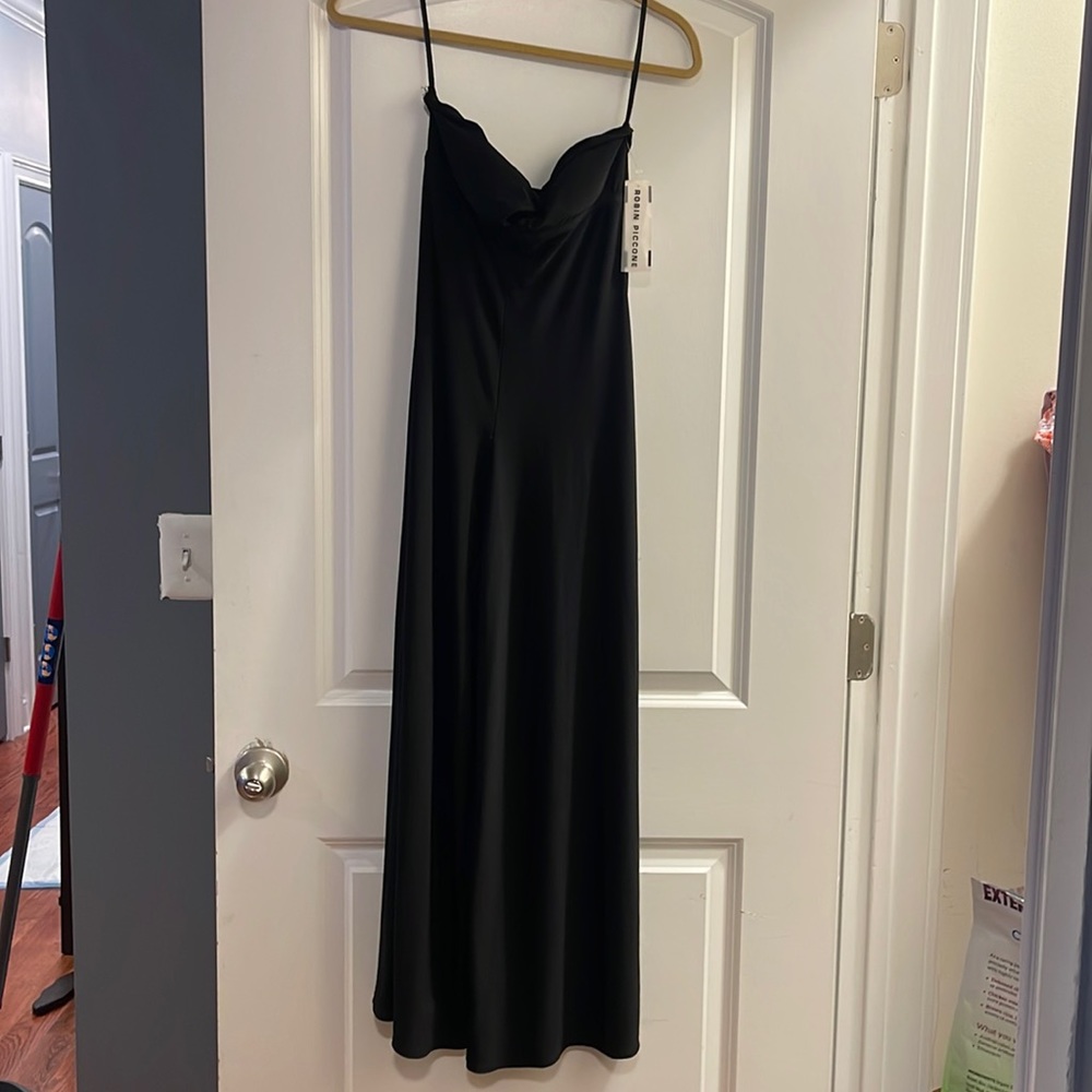 Robin Piccone small black key hole black jumpsuit can be worn over swimwear